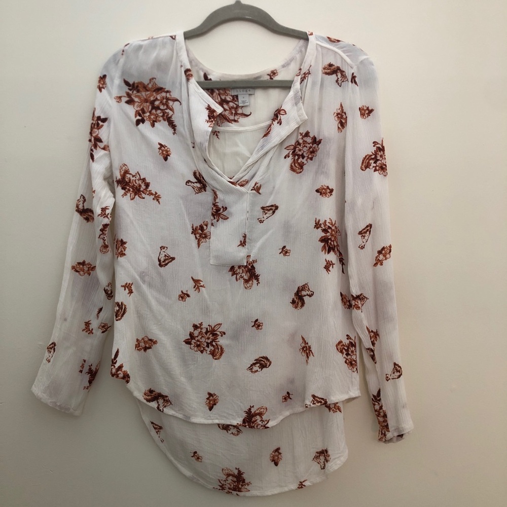 White and orange floral blouse
